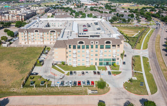 an aerial view of building with car parking at Residences at 3000 Bardin Road, Grand Prairie, 75052