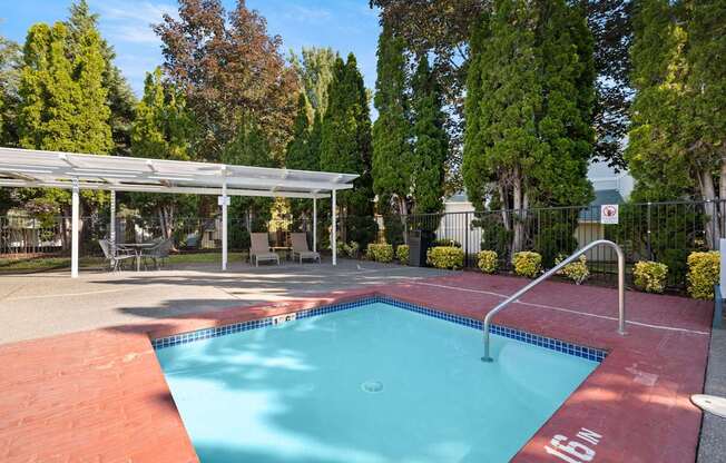 A small pool with a 15 Inches sign on the side at Clackamas Trails Apartments, Oregon, 97222