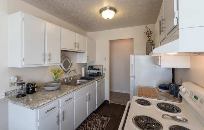 This is a picture of the kitchen in the 850 square foot, 1 bedroom, 1 bath apartment at Fairfield Pointe Apartments in Fairfield, Ohio.