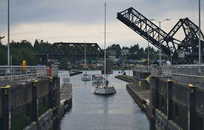 A boat is passing through a drawbridge.
