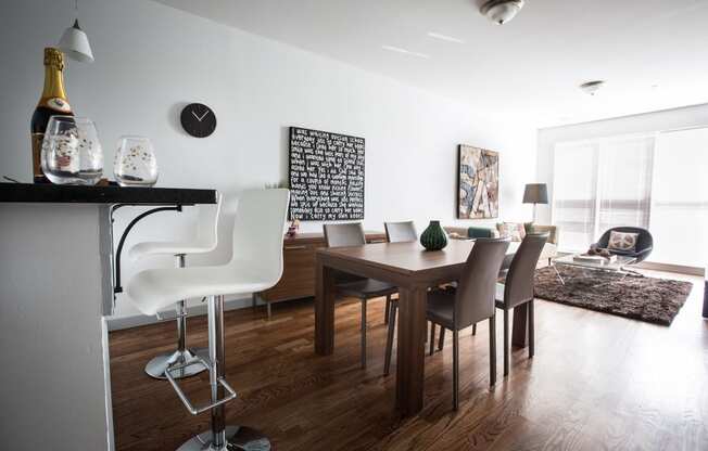 Open layout of breakfast bar, dining room and living room area