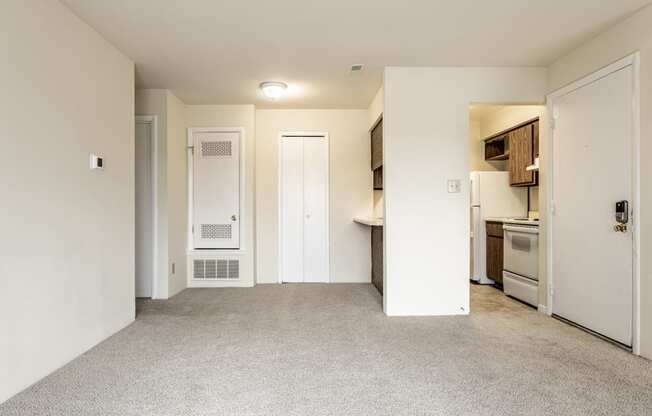 a renovated living room and kitchen in an apartment