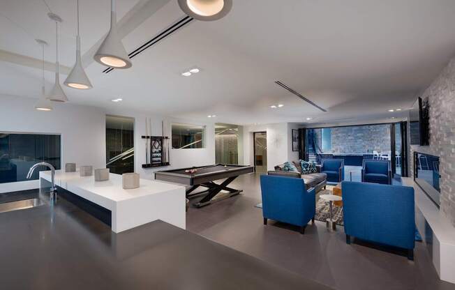A modern kitchen with a dining area and a living room.