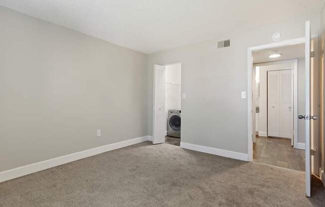 Model bedroom with carpet at Seven Lakes at Carrollwood in Tampa, Florida.