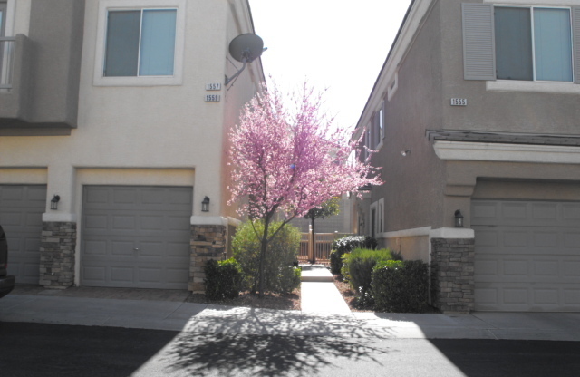 Spacious Henderson townhouse featuring   3 bedrooms PLUS 2 car garage.