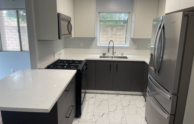 Updated Two Story Townhome w/ Two Car Garage