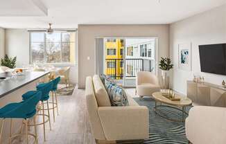A modern living room with a bar area and a view of a yellow building outside.