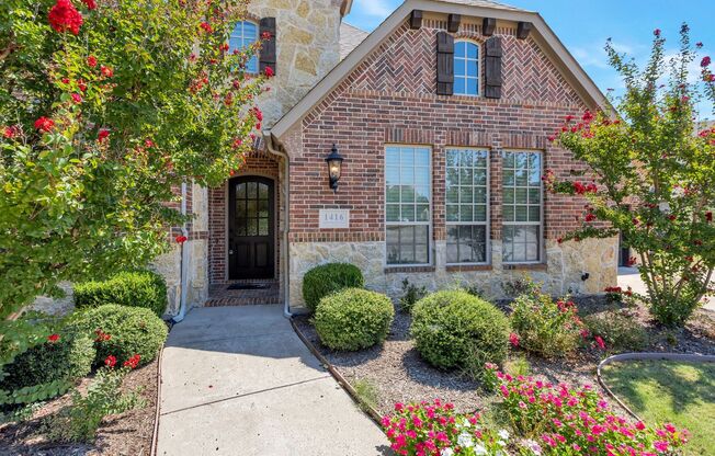 Grand Flower Mound home on heavily treed lot