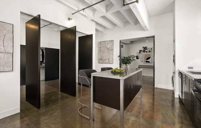 a kitchen with a long island in the middle of a room