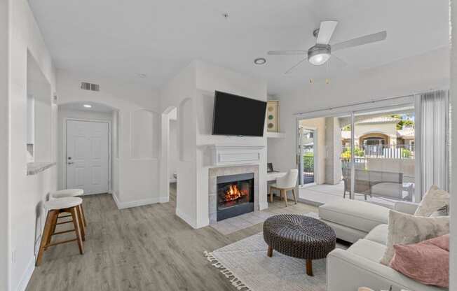 a living room with a fireplace and a television