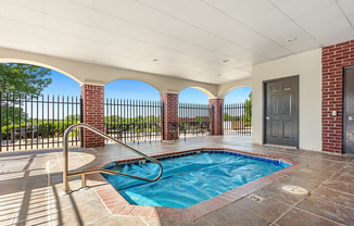 Relax and unwind in this luxurious patio jacuzzi with a stunning view.