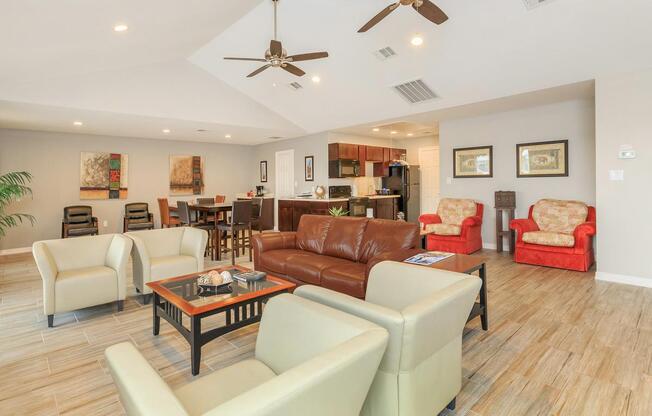 a living room filled with furniture and a wood floor