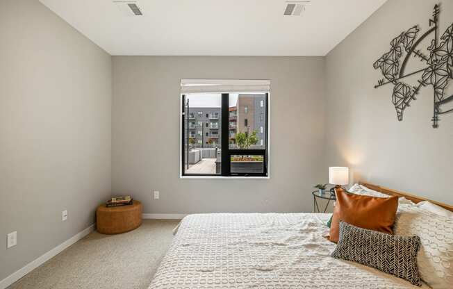 a bedroom with a large window and a bed at EagleRidge Plaza Residences, North Dakota, 58104