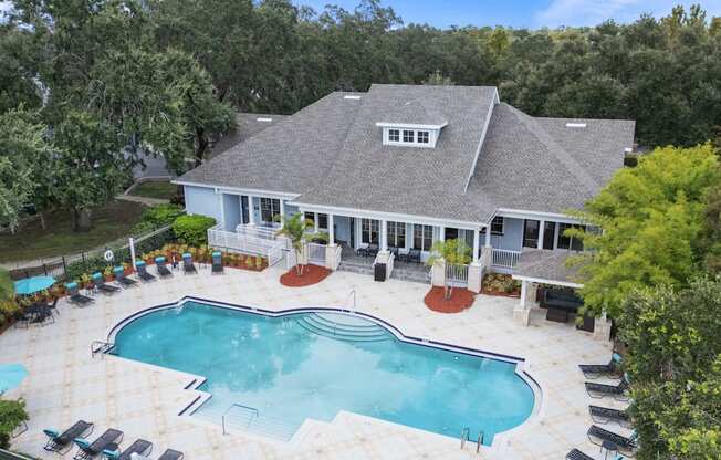A large house with a pool in the backyard.