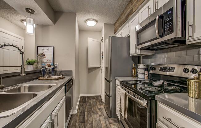 a large kitchen with stainless steel appliances