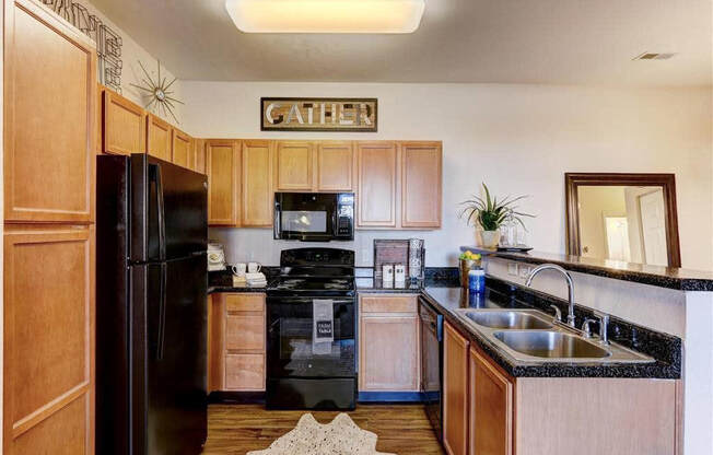 Residence at North Penn living room with hardwood flooring and granite countertops