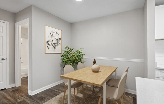 Model Dining Room with Wood-Style Flooring at Element 41 Apartments in Marietta, GA.