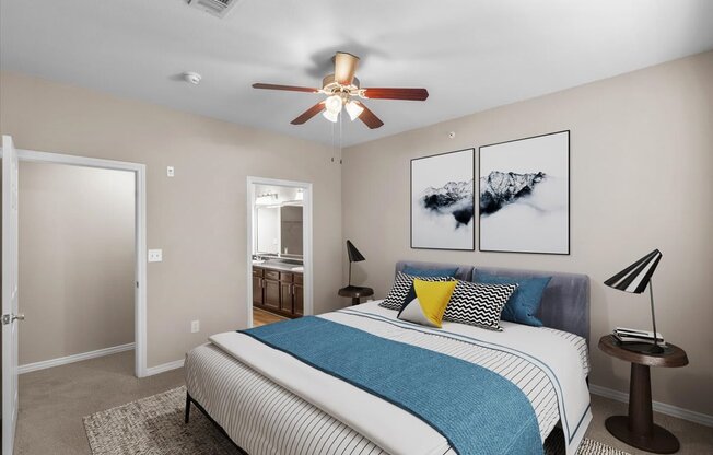 a bedroom with a bed and a ceiling fan