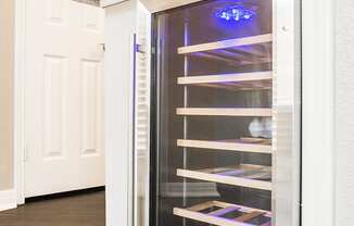 a refrigerator with its door open in a kitchen