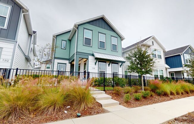 Extraordinary single-family Courtyard Home nestled within David Weekley's exclusive enclave of Tidal Pointe!