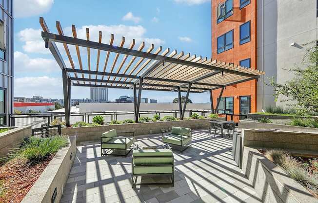 Rooftop patio with comfortable chairs at Bayview Apartments, Emeryville, CA, 94608