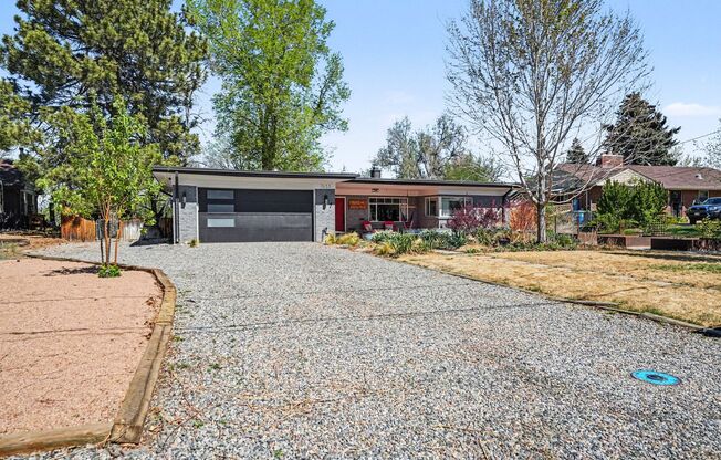 Sunlit Wheat Ridge Gem with Huge Wooded Backyard