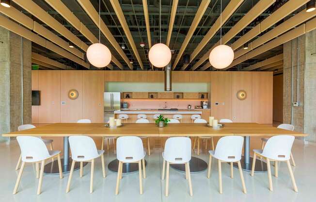 A modern dining room with a long table and chairs at Allied Harbor Point, Baltimore