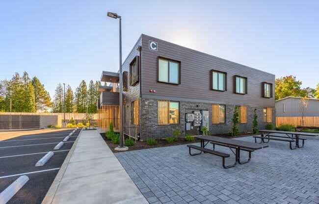 a building with a picnic table in front of it