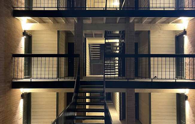 A building with a staircase and a metal railing.