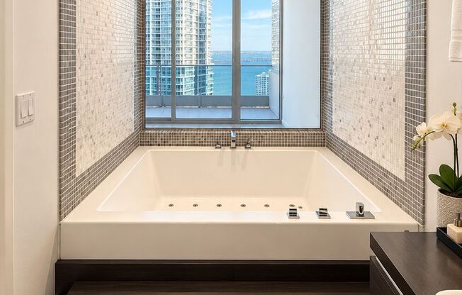 Breathtaking views from every corner of this 33rd-floor unit. Highly desirable 1-bedroom, 1.5-bath residence in Downtown’s most iconic building.