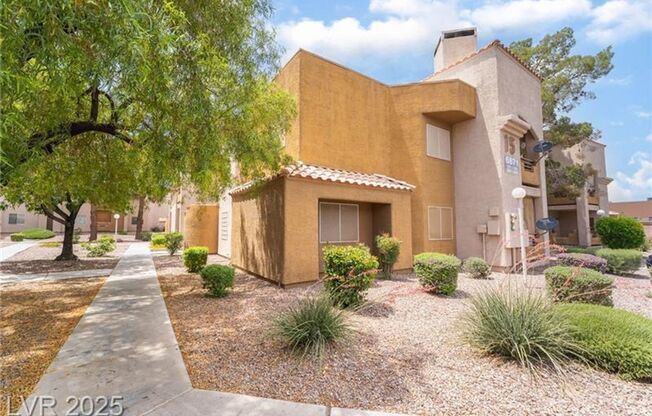 INVITING 2 BEDROOM TOP FLOOR CONDO IN A CENTRAL LOCATION NEAR UNLV AND THE STRIP