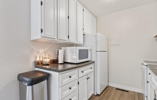 clubhouse kitchen with a microwave and a refrigerator