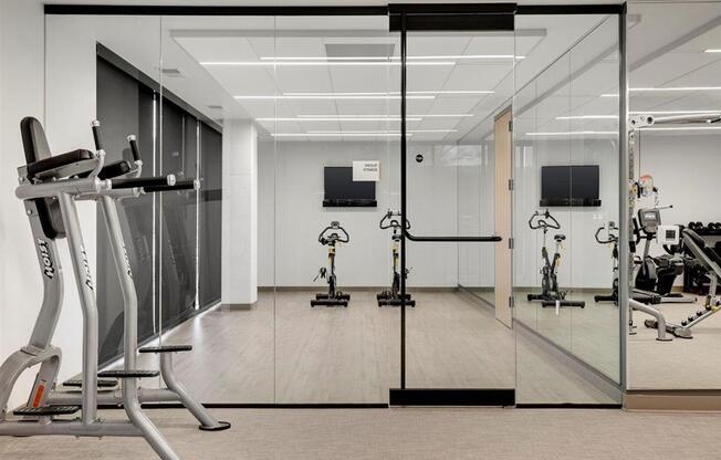 Fitness center and yoga studio with large glass windows and doors