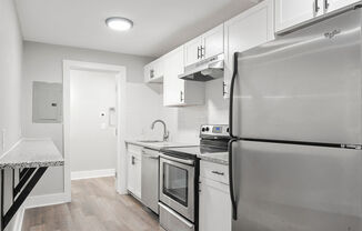Renovated Kitchen Stainless Steel Appliances Granite Countertops Soft Close Cabinetry