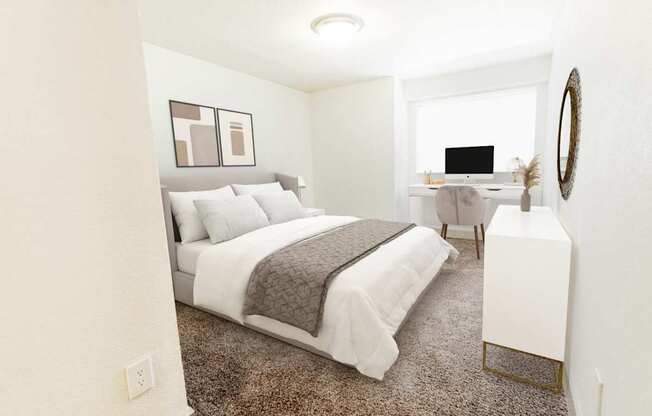 A bedroom with a large bed and a desk with a computer.