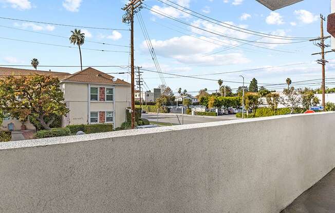 Private balcony with view of neighborhood.