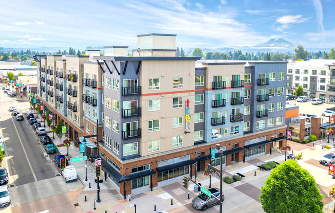 an aerial view of an apartment building on a city street