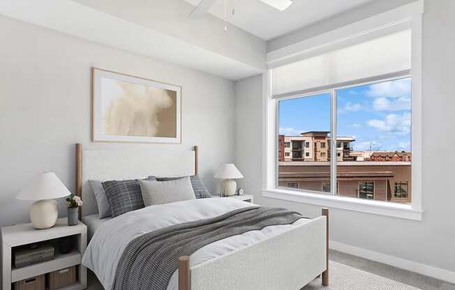 Model Bedroom with Carpet and Window View at Seven Skies Apartments located in Sandy, UT.