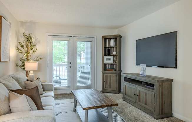 a living room with a couch and a tv