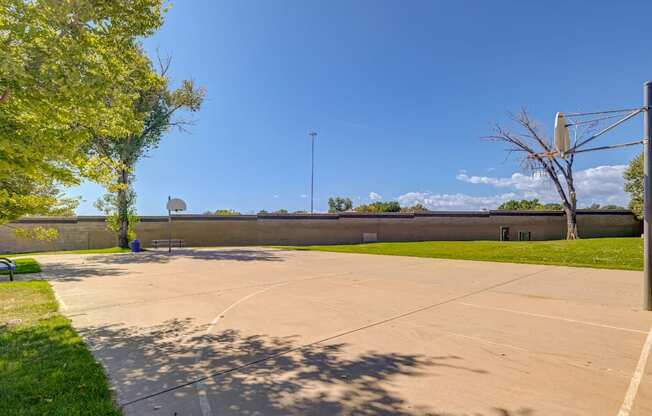 A large open parking lot with a clear blue sky above.