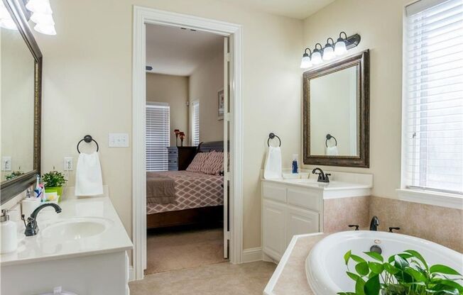 Grand entry, Open floor plan with high ceiling, Spacious rooms, Elegant kitchen featuring stainless steel appliances.
