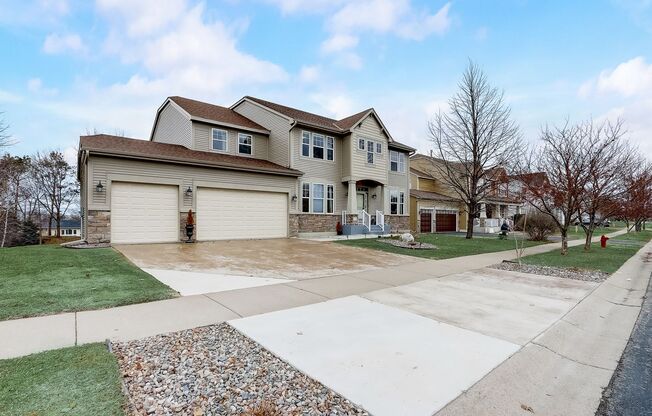 Grand 5 bed 4.5 bath Maple Grove Home w/ 3-Car Garage! Fully Furnished