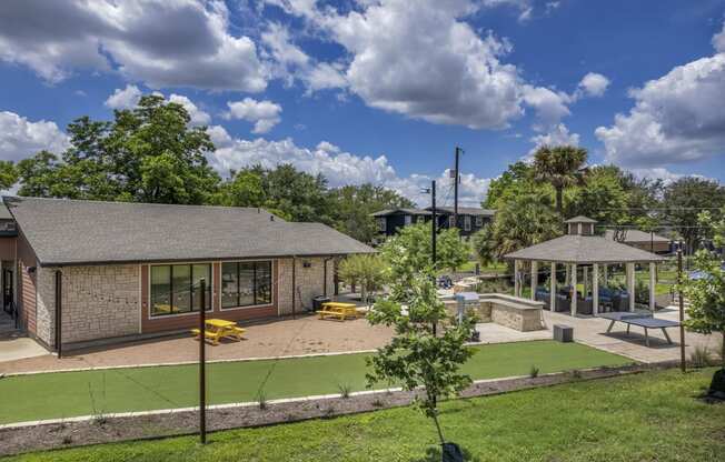 a backyard with a grassy area and a gazebo  at Sunset Ridge, Texas