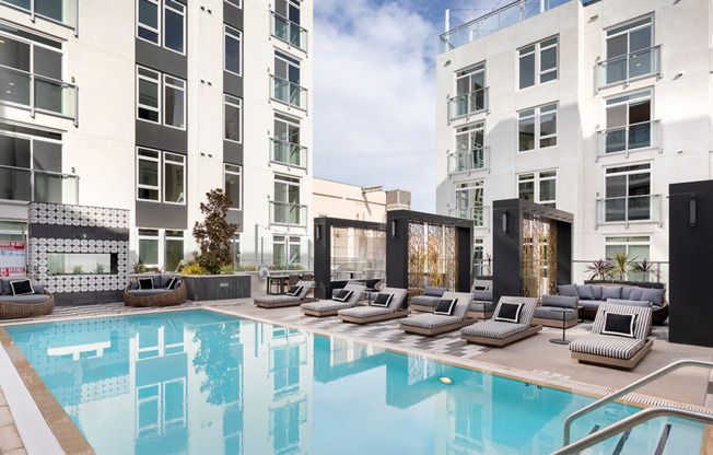 Swimming pool with sundeck, chaise lounges and exquisite outdoor couches