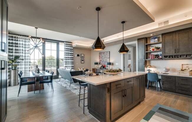 Fitted Kitchen With Island Dining at The Hamilton, Dallas, Texas
