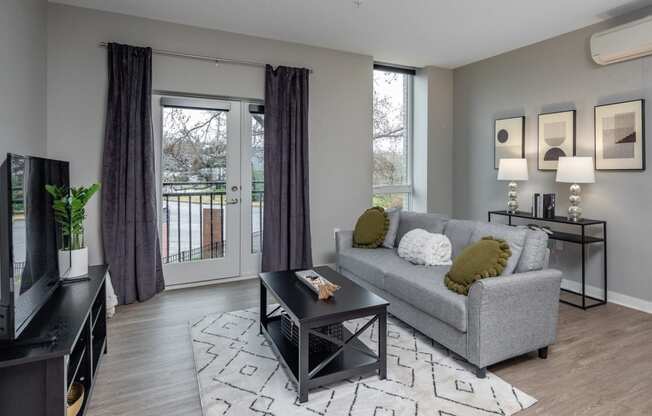 an open living room with a couch and a television