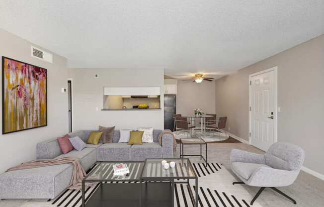 the living room of an apartment with a couch and a coffee table