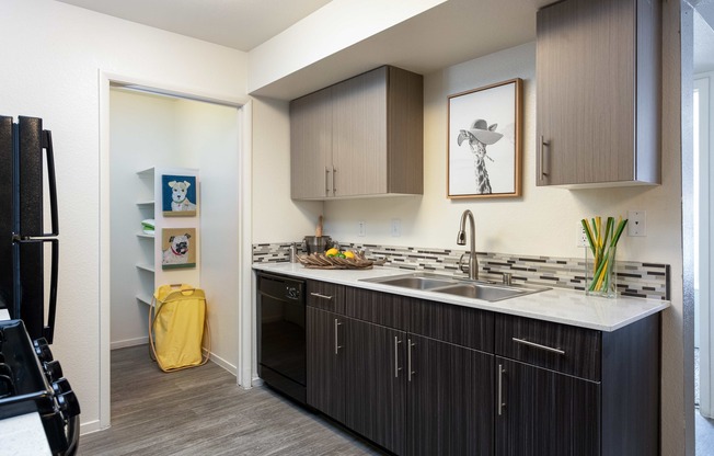 a kitchen with wooden cabinets and a white counter top