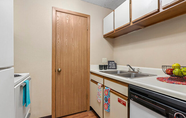 a kitchen with a sink and a dishwasher