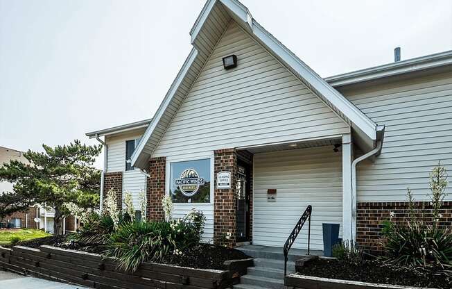 a white building with a blue sign on it